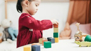 Child playing with building blocks