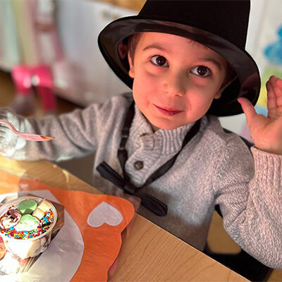 Toddler celebrating his birthday with a cupcake at the learning center at Porter Lake in Longmeadow, MA.